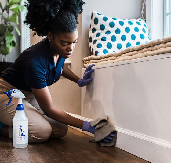 Home-Clean-Heroes-cleaner-wiping-down-baseboards